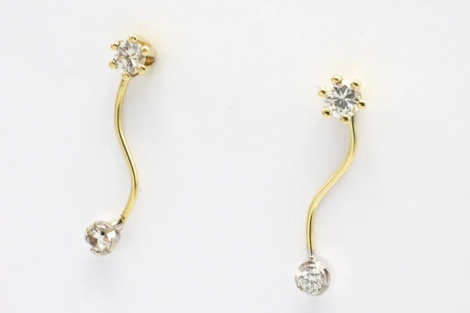 Double diamond pendant earrings in 14 carat gold.