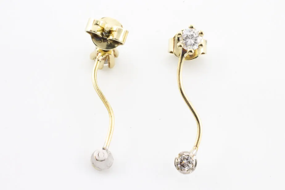 Double diamond pendant earrings in 14 carat gold.