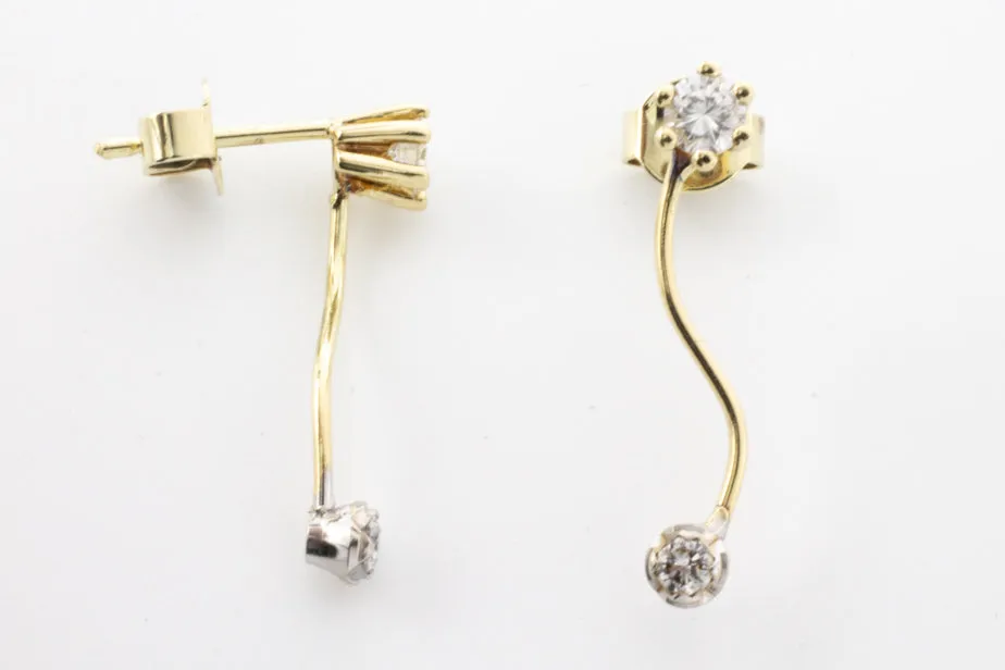 Double diamond pendant earrings in 14 carat gold.