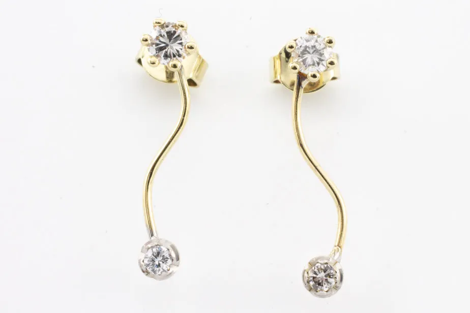 Double diamond pendant earrings in 14 carat gold.