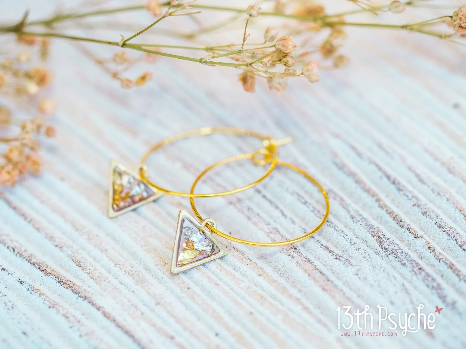 Hypoallergenic gold hoop earrings with triangle shape charm