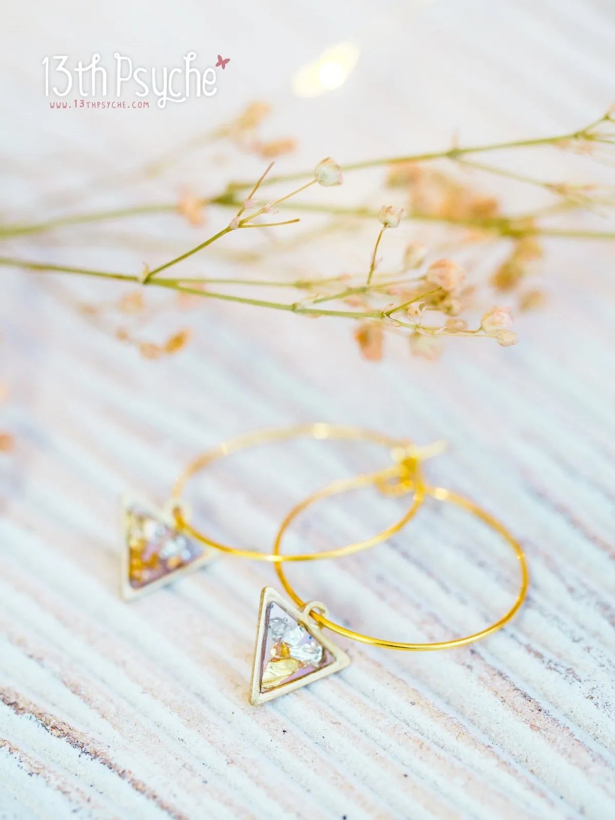 Hypoallergenic gold hoop earrings with triangle shape charm