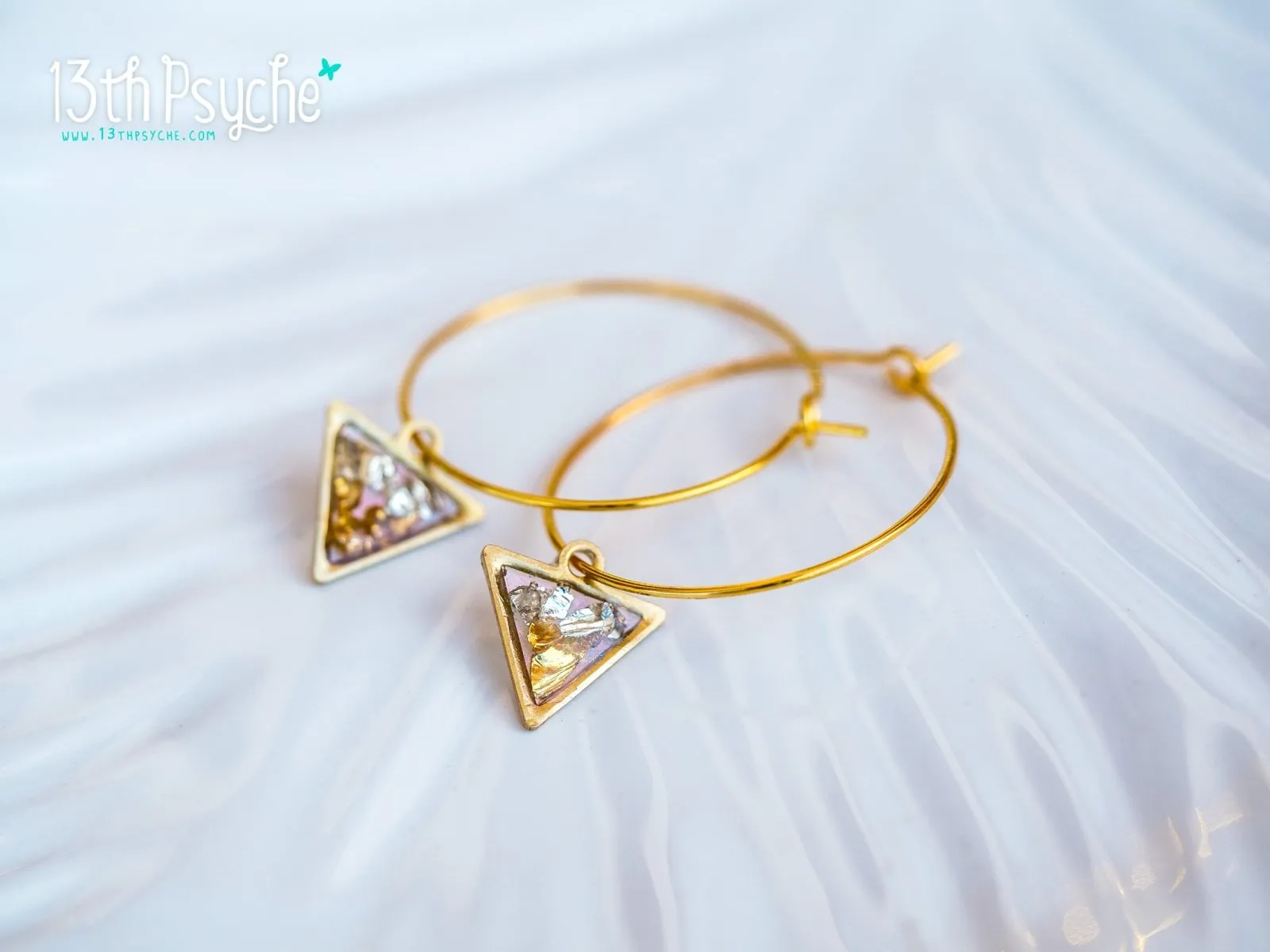 Hypoallergenic gold hoop earrings with triangle shape charm