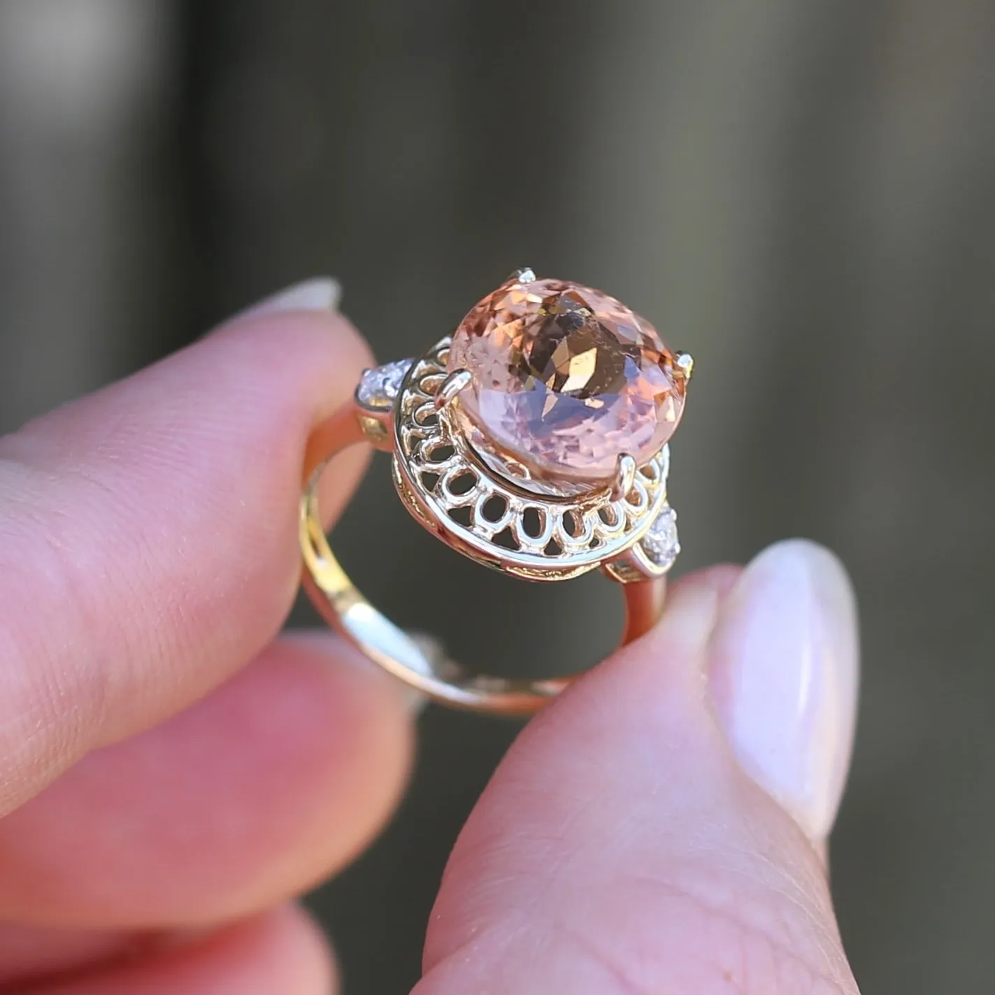 Oval Peach Tourmaline Ring with Pierced Wire Surrounds and Diamonds in the Shoulders, 9ct Yellow Gold, size N or 6.75