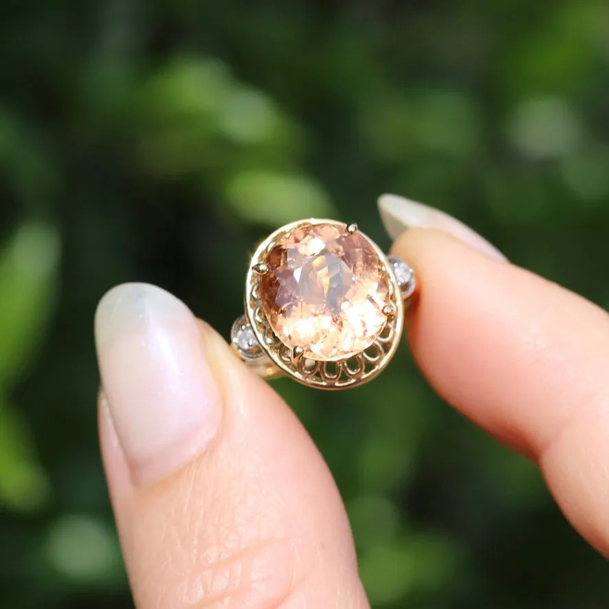 Oval Peach Tourmaline Ring with Pierced Wire Surrounds and Diamonds in the Shoulders, 9ct Yellow Gold, size N or 6.75