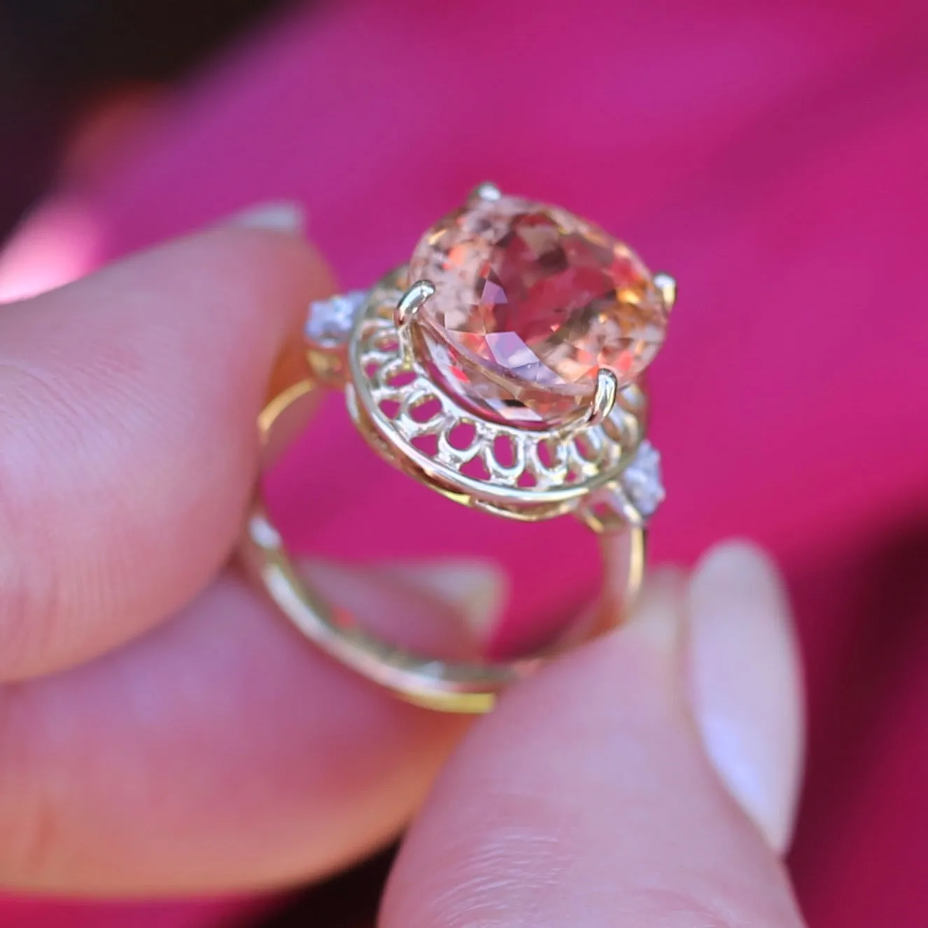 Oval Peach Tourmaline Ring with Pierced Wire Surrounds and Diamonds in the Shoulders, 9ct Yellow Gold, size N or 6.75