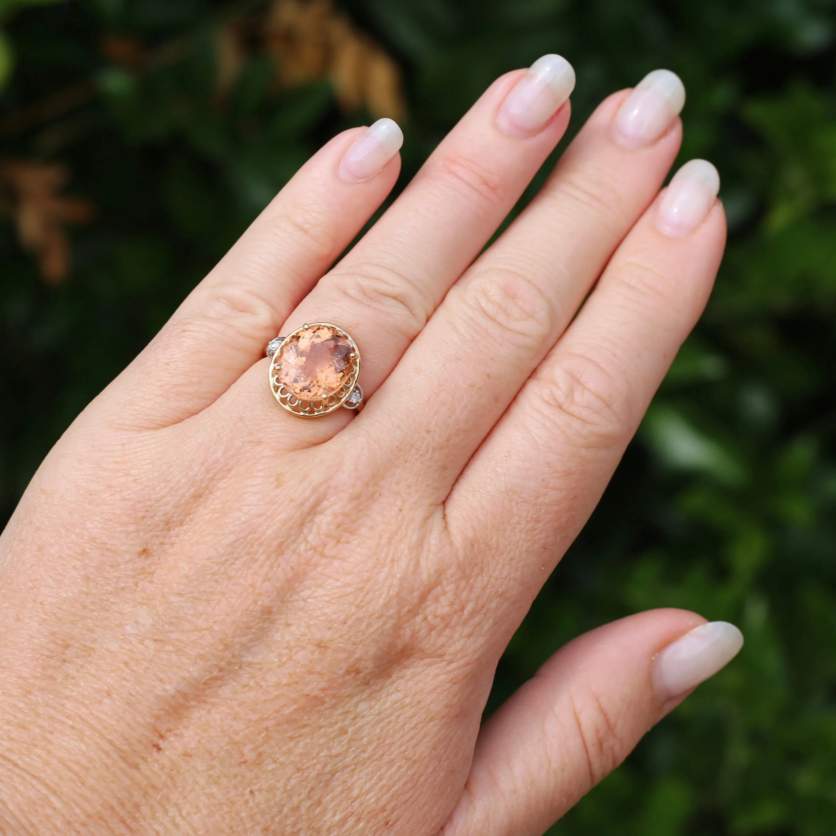 Oval Peach Tourmaline Ring with Pierced Wire Surrounds and Diamonds in the Shoulders, 9ct Yellow Gold, size N or 6.75