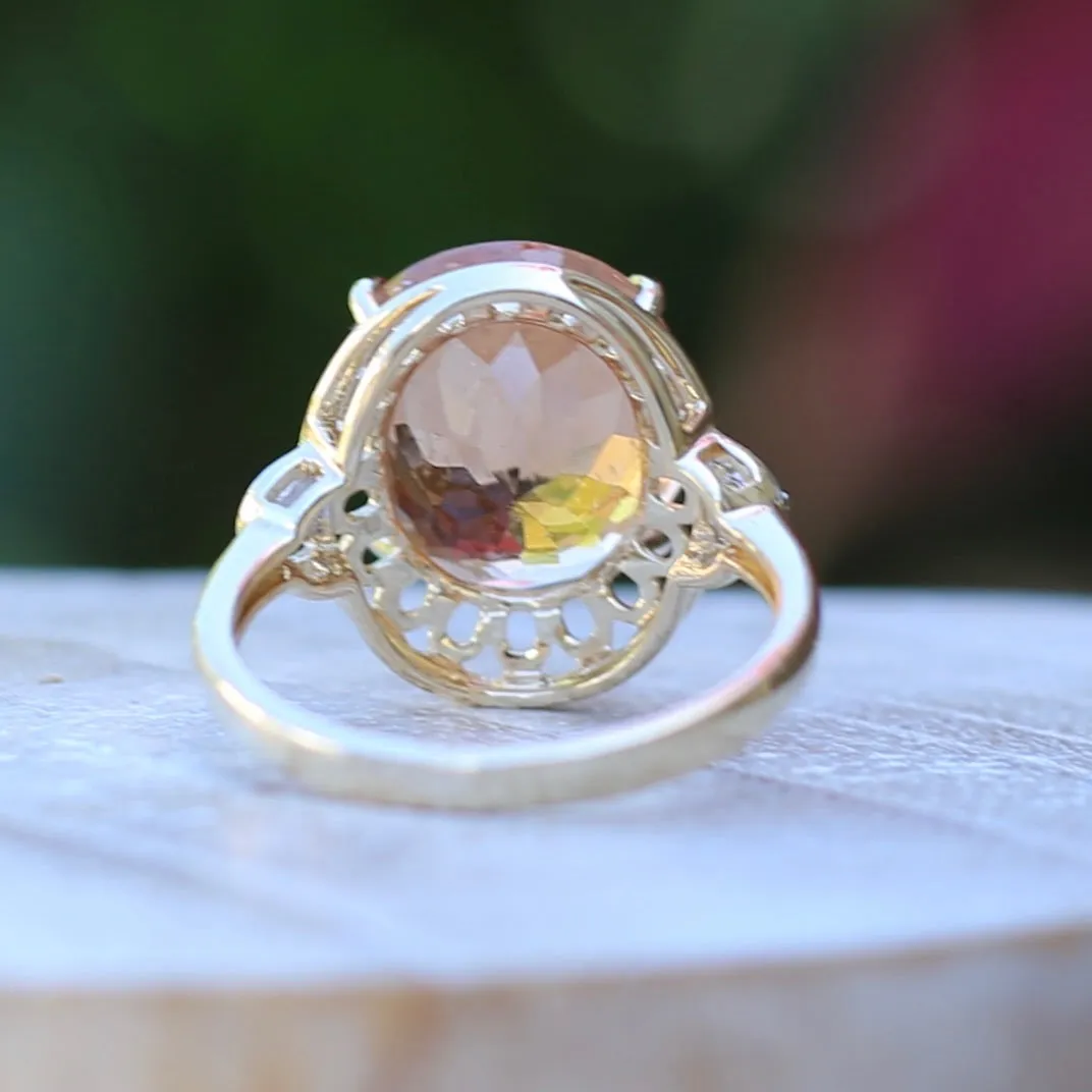 Oval Peach Tourmaline Ring with Pierced Wire Surrounds and Diamonds in the Shoulders, 9ct Yellow Gold, size N or 6.75