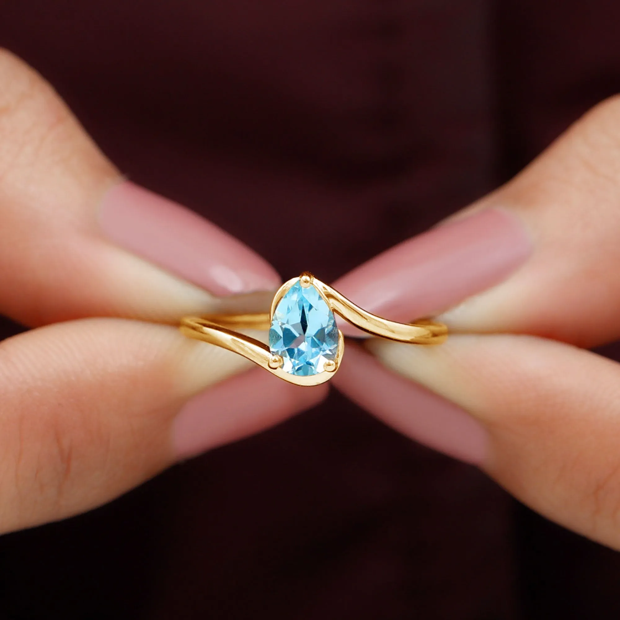 Pear Cut Sky Blue Topaz Solitaire Bypass Ring