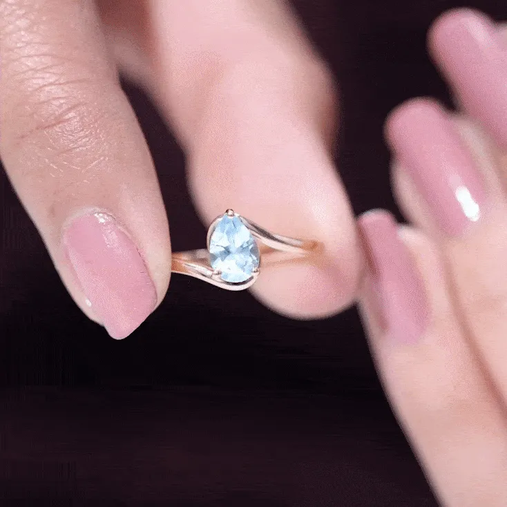 Pear Cut Sky Blue Topaz Solitaire Bypass Ring